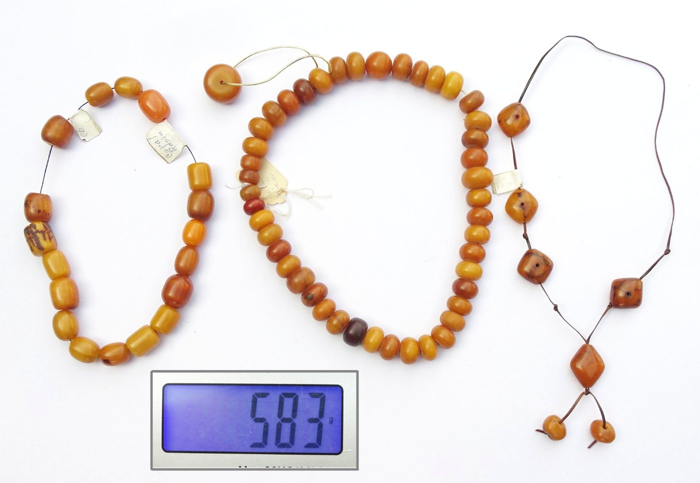Three phenolic resin 'African amber' bead necklaces, 583 g