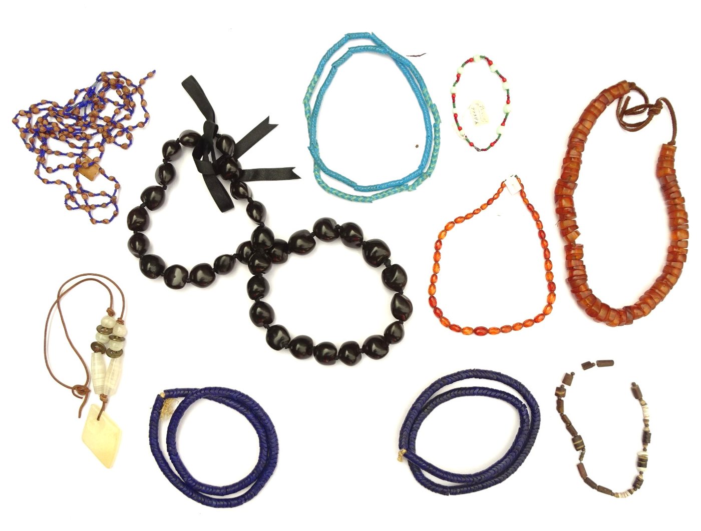 Box lot of 11 mixed bead necklaces (snake beads, amber-color, kukui, etc.)