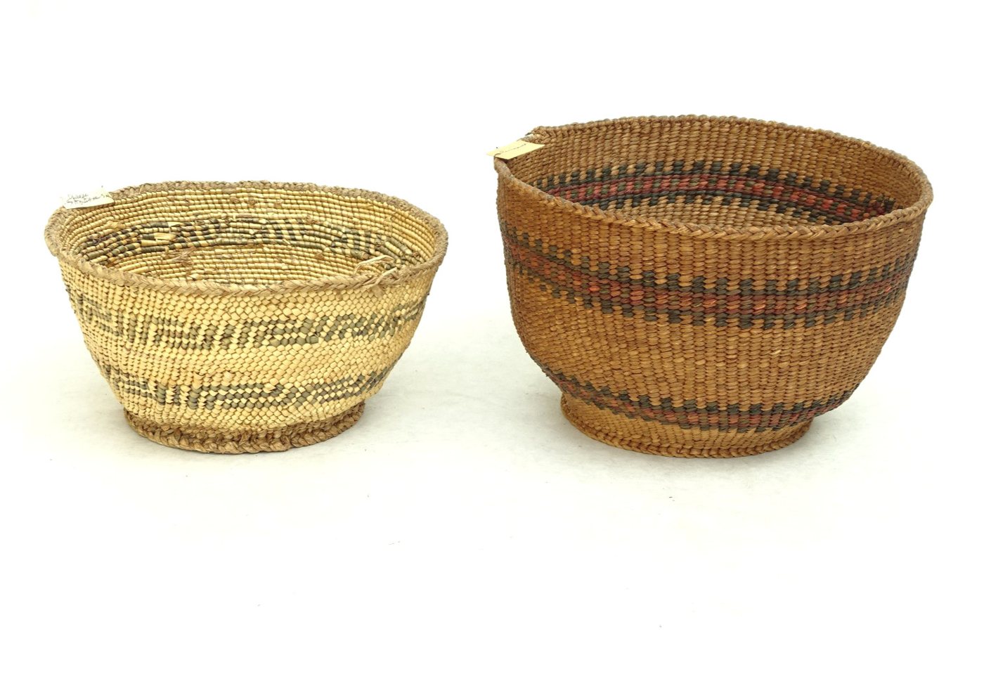 Two Washington coast twined bowl baskets