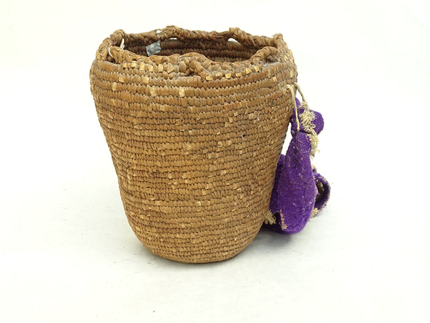 Small Klickitat coiled cedar-root basket with wool strap