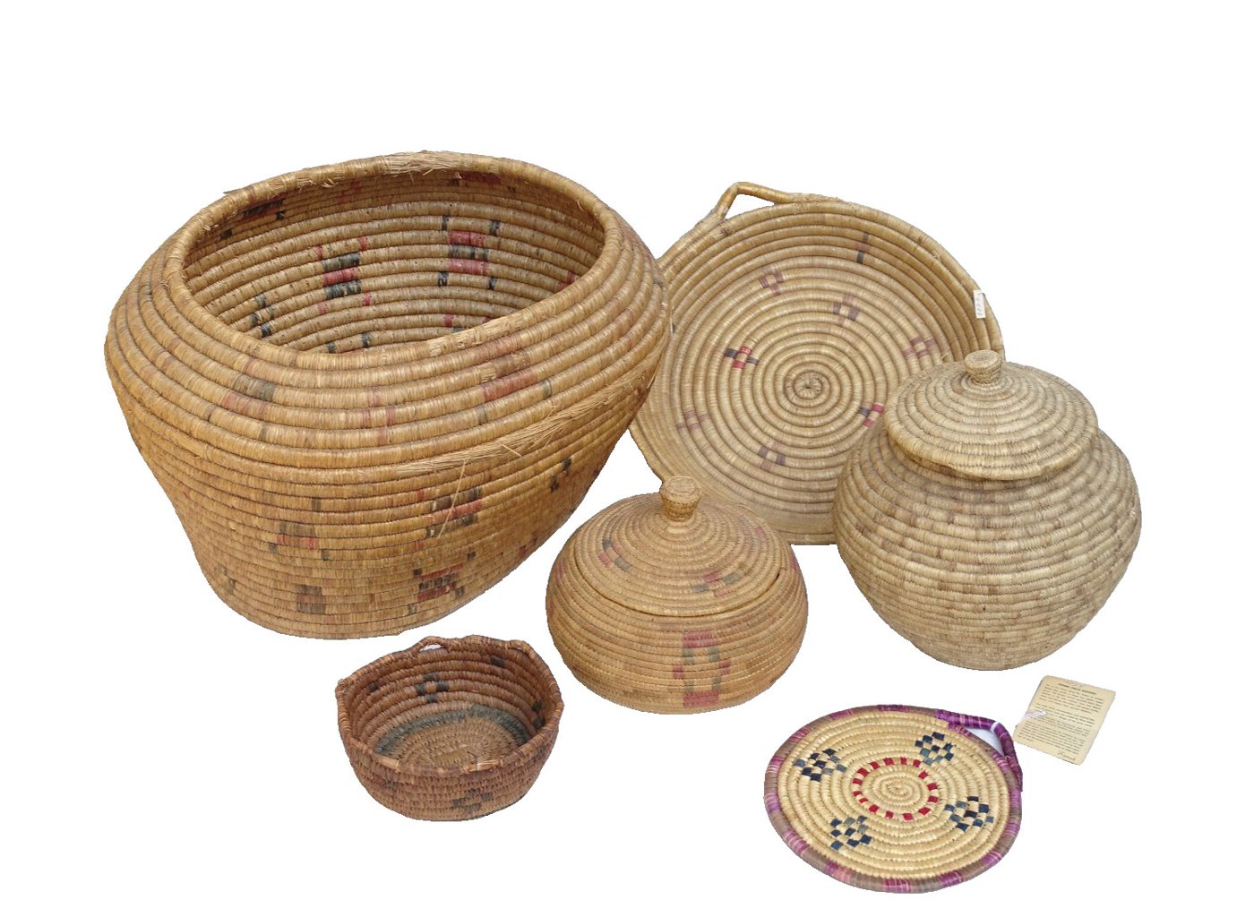 Six Alaska coiled grass baskets