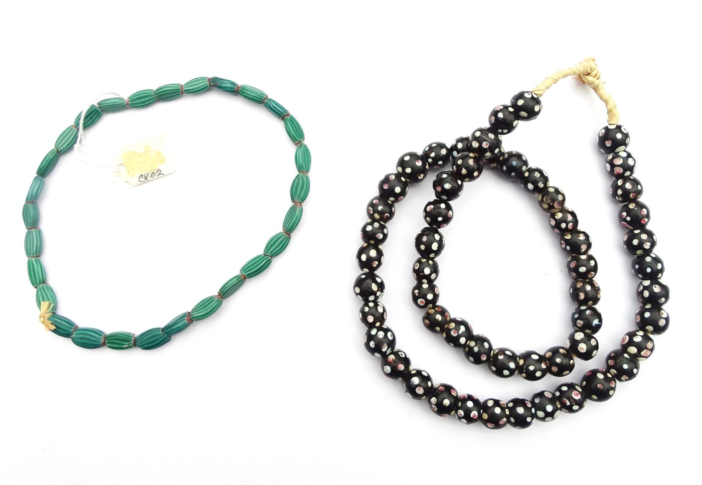 Two strands: green melon 'watermelon' beads and black skunk beads